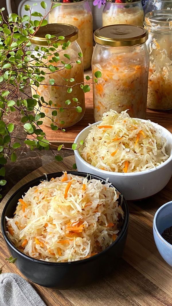 Bowls and jars filled with white sauerkraut
